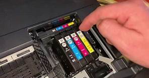 How to replace Epson WorkForce printer ink cartridge change cartridges Epson multifunction device