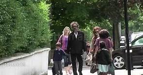 Helena Bonham Carter with Tim Burton and her kid Billy walking in London