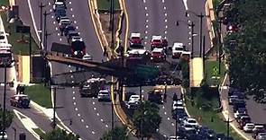 SCARY SCENE: Pedestrian bridge collapses onto Washington DC highway, injuring several people