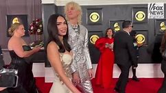 Machine Gun Kelly and Megan Fox walk the Grammy Awards red carpet together