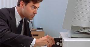 Planting the virus and checking the bank account balance – Office Space (1999)