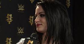 Paige celebrates her successful title defense at NXT ArRIVAL
