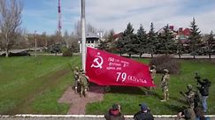 Russian soldiers raise Soviet's ‘victory flag’ in occupied city Kherson