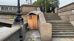 Homeless man's weather-proofed wooded shed under Battersea Bridge