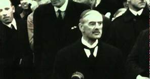 Neville Chamberlain returns from Germany with the Munich Agreement
