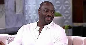 FULL INTERVIEW PART ONE: Adewale Akinnuoye-Agbaje on His Childhood & More!