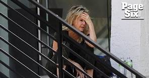Heather Locklear appears distressed, bizarrely walks on ledge of office building