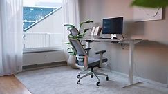 Premium stock video - Home office desk and chair with desktop computer near the open window