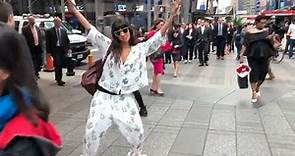 Jameela Jamil strikes a pose in Times Square wearing pajamas