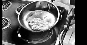 Julia Child making an omelette