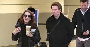 Producer Jerry Bruckheimer And Wife Linda Are Fashionable Flyers At LAX