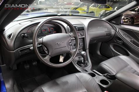 Interior view of the 2004 Ford Mustang Mach I, highlighting its driver-focused cockpit