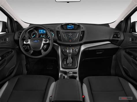 A clean and spacious interior of a 2014 Ford Escape, showcasing its practicality for families