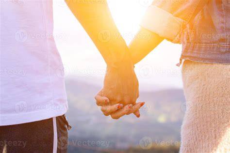 Couple holding hands