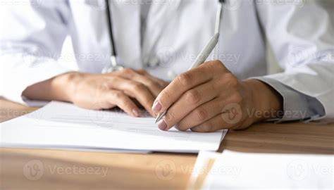 Doctor signing medical document