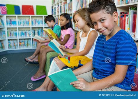 Kids reading books in a library
