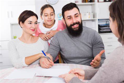 Family signing documents
