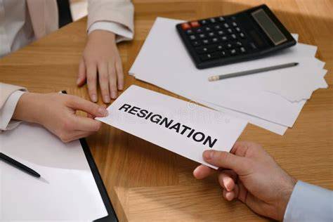 Hand giving resignation letter