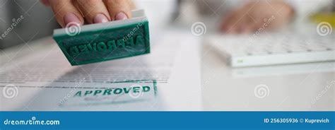 Hand putting stamp approved