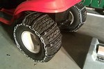 How to Make Chains for Tires On a Lawn Mower