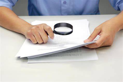 Magnifying glass on document