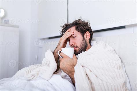 Man with a cold in bed