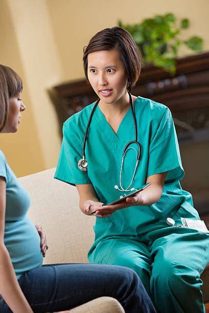 Midwife explaining something to patient