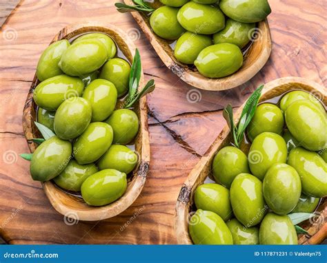 Olives on wooden table