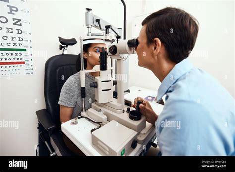 Ophthalmologist checking eye