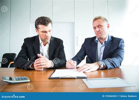 People signing a document