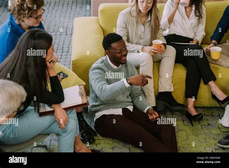 Person explaining something to a group of people