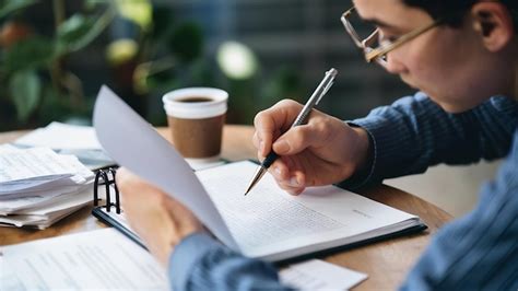 Person proofreading a document
