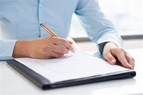 Person reviewing and proofreading a document