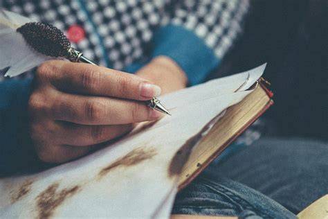 Person writing on paper
