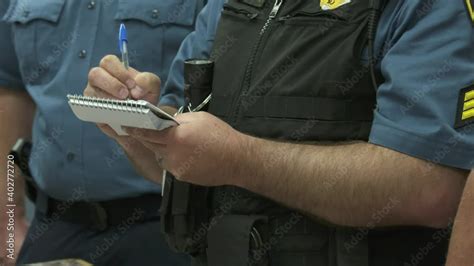 Police officer taking notes