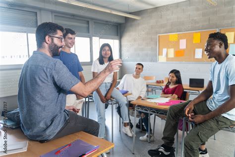 Students talking to teacher