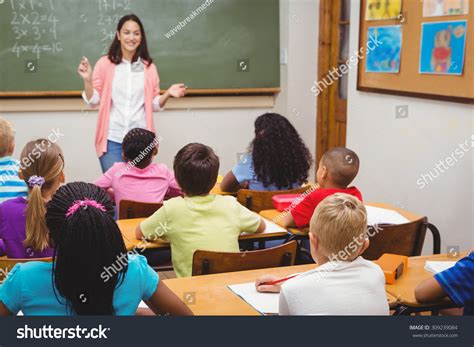 Teachers in a classroom with children