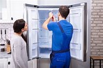 Walk-In Freezer Repair Man Fixing It