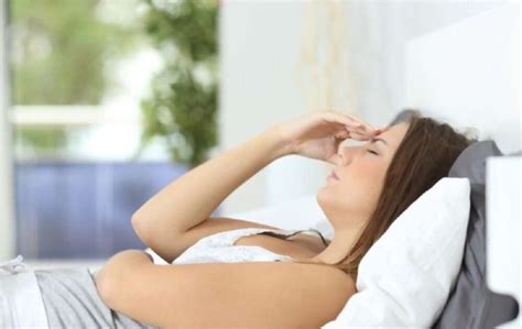 What causes nausea when lying down