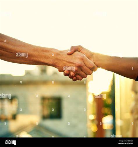Image of people shaking hands in agreement