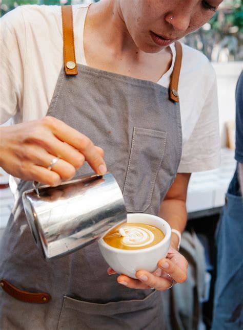 Barista making latte art