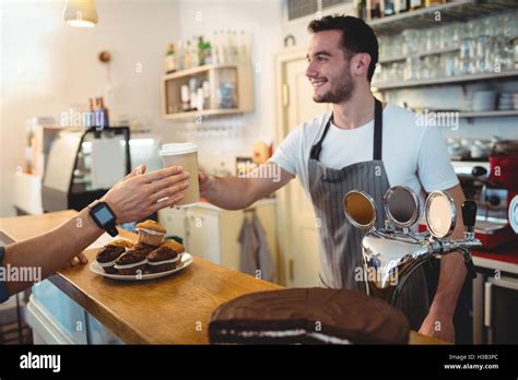 Barista serving coffee