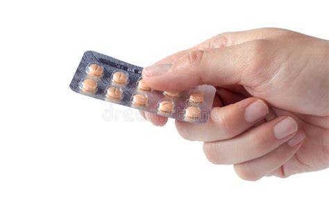 Hand holding a blister pack of pills