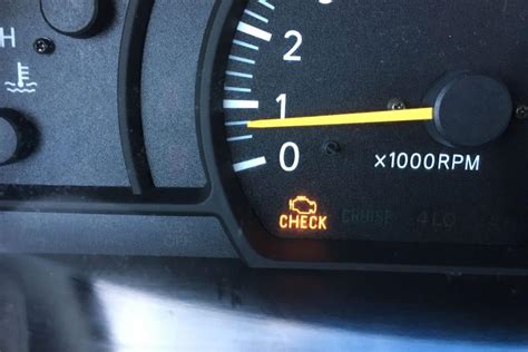 check engine light with arrow facing down