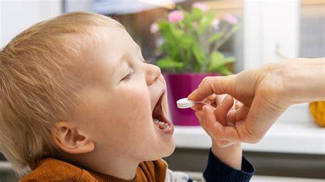 Child getting Vitamin A supplement
