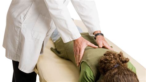 Chiropractor adjusting a patient