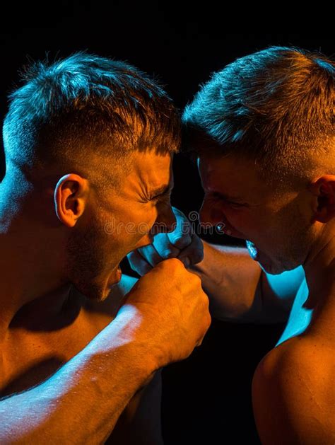 close-up of two men fighting mma