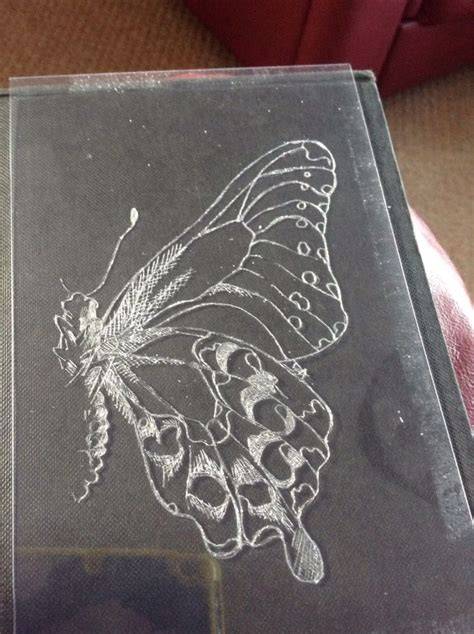 drypoint artist scratching plate