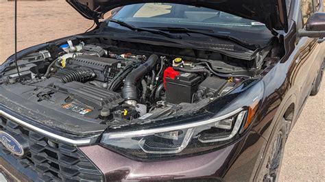 Close-up of the engine bay of a Ford Escape ST-Line, highlighting its turbocharged powertrain