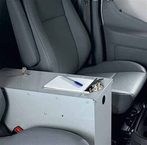 Interior view of a Ford Transit center console with various storage compartments